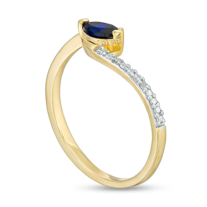Sideways Marquise LabCreated Blue Sapphire and Diamond Accent Bypass Promise Ring in Solid 10K Yellow Gold Goldia Rings Sideways Marquise LabCreated Blue Sapphire and Diamond Accent Bypass Promise Ring in Solid 10K Yellow Gold Goldia Rings